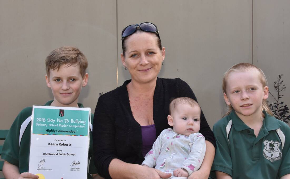 YOUNG ARTIST: Kearn Roberts with his Highly Commended certificate and his mother Amanda, Amaya and Riley back at Beechwood Public School after an exciting weekend.