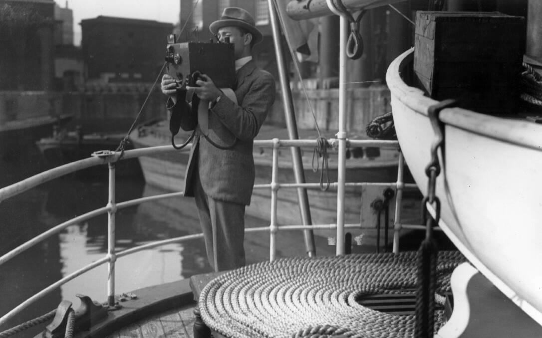 Sir George Hubert Wilkins taking a photograph in 1921. Picture: Getty