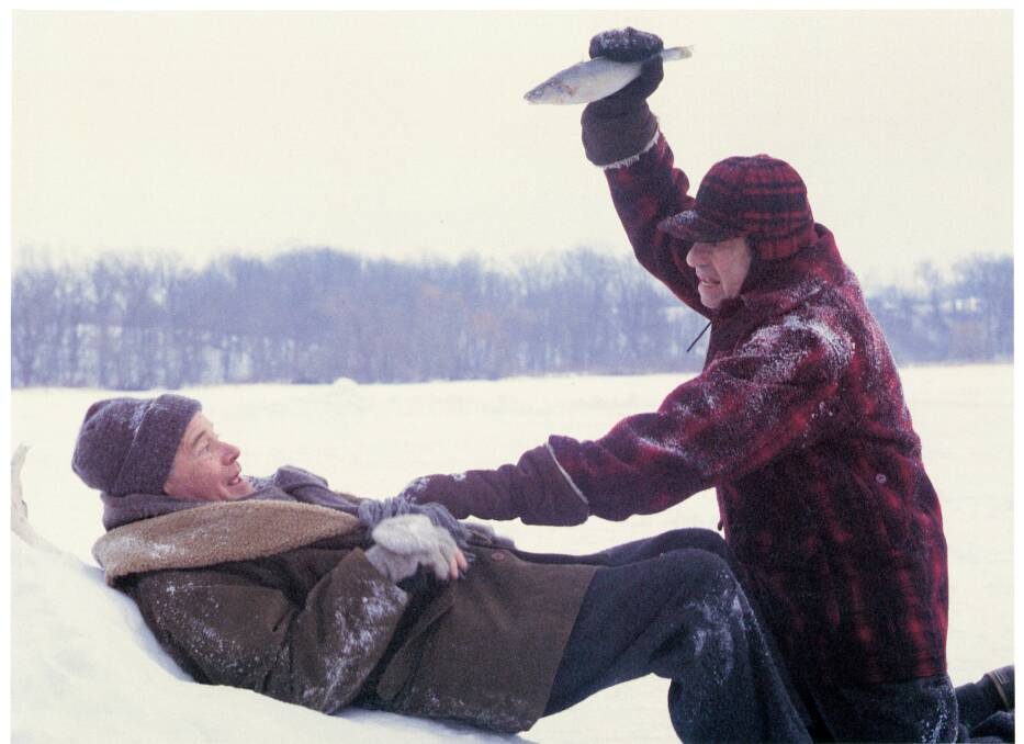 Walter Matthau, right, lays into Jack Lemmon with a fish, in a scene from the film 'Grumpy Old Men', 1993. Picture: Getty Images