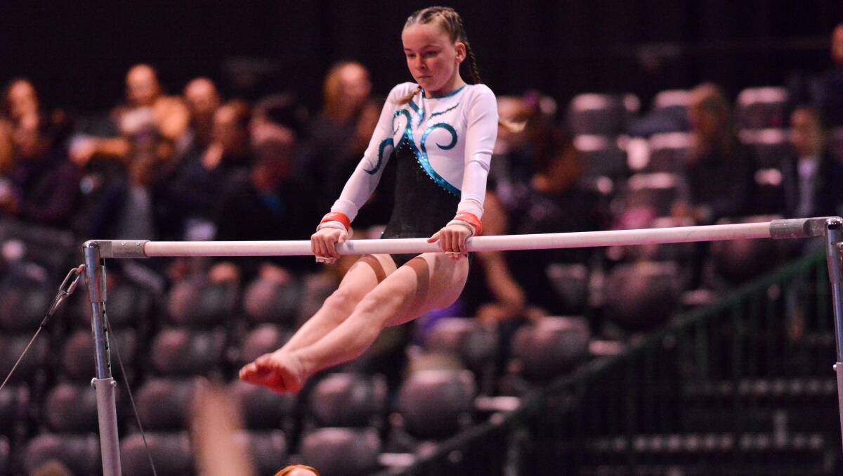Up and at it: Shaelei Beazley competing on the uneven bars. Photo: supplied