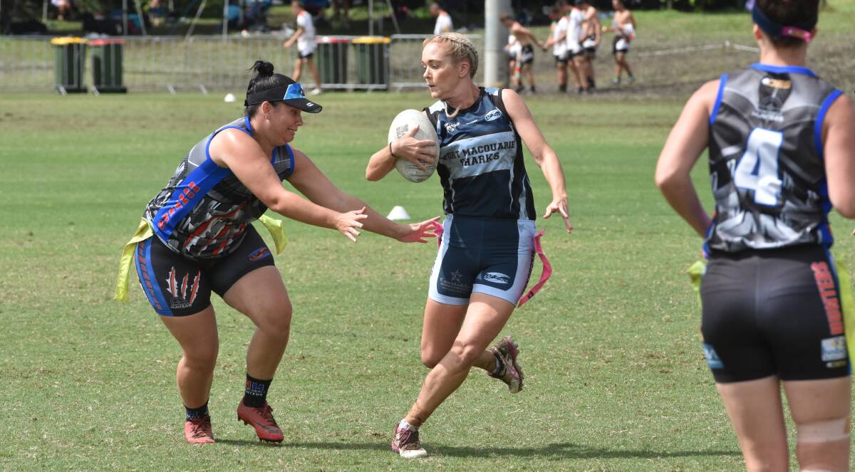 Uphill task: Laura Cudmore evades the defence during this year's oztag State Cup in Coffs Harbour. Photo: Paul Jobber