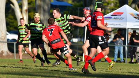 Vikings captain Lyndon Gale takes the ball into the Pirates defence. Photo: Paul Jobber