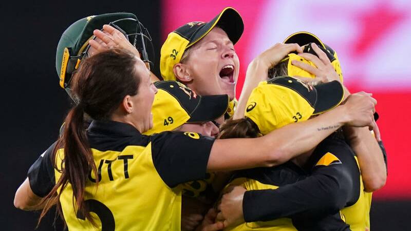 We've done it: Australian players celebrate winning their fifth T20 World Cup title on Sunday night.