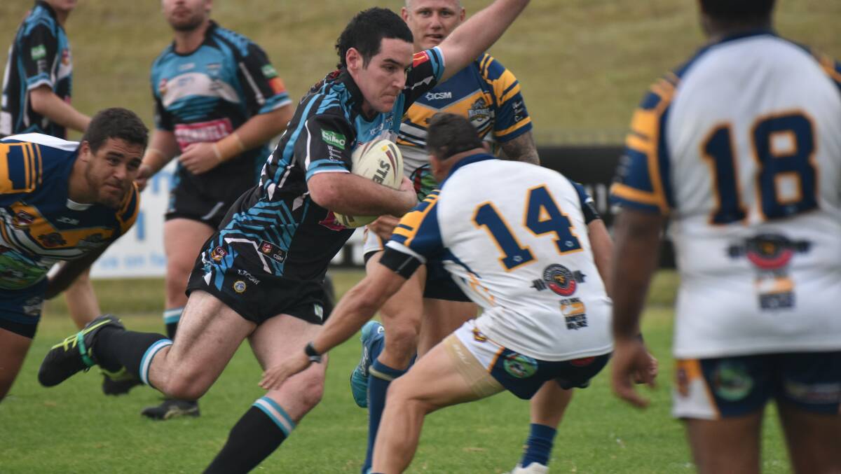 Hard yards: Ben Read carts the ball forward for the Sharks on Saturday. Photo: Rob Dougherty