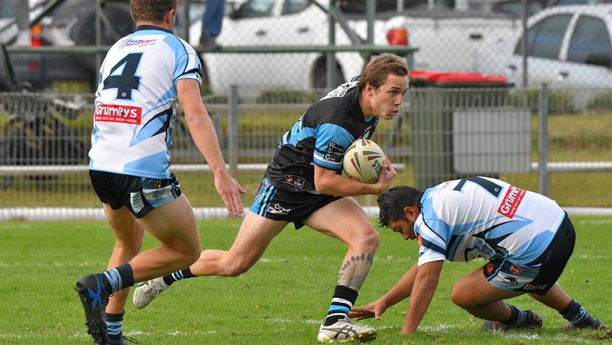 Delayed start: Port Sharks fullback Mitch Wilbow finds a gap in the Port City defence.