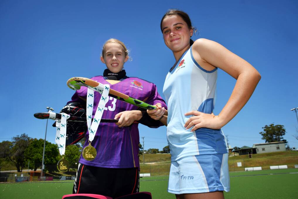 National title: Teleah Walker and Maddi Drewitt won gold with the NSW under-13 indoor hockey side at Goulburn. Photo: Ivan Sajko