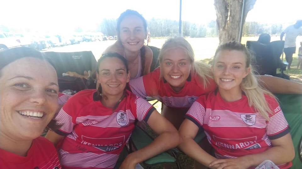 All smiles: Port Pirates enjoy a much-needed rest during the Crescent Head Sevens. Photo: Facebook