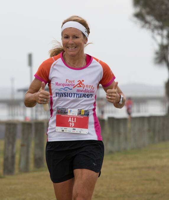 Thumbs up: Ali Fitch won the women's Triple Bridge Buster at the Forster Running Festival on Sunday. Photo: TLC Photography Port Macquarie