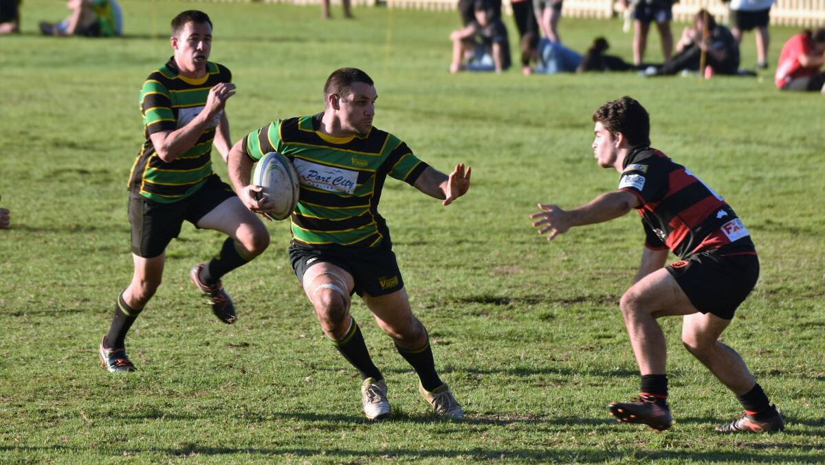Fending away: Andrew West evades the Coffs Harbour defence in the Vikings 47-12 win on Saturday. Photo: Laura Telford