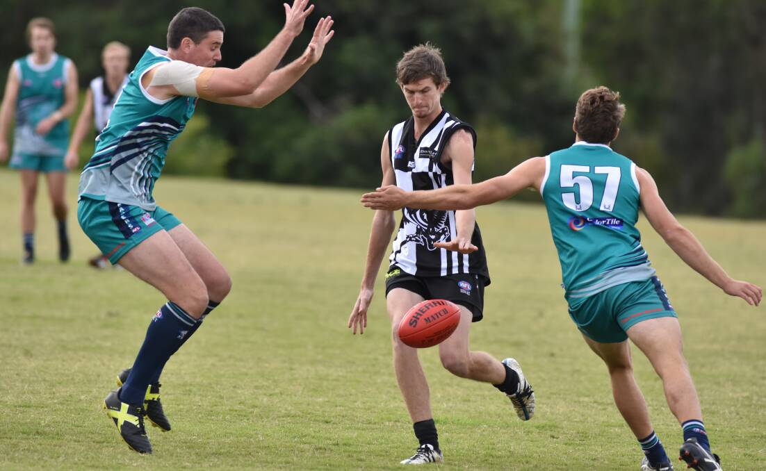 Under pressure: Luke Boxhall puts boot to ball in the Magpies defeat to Grafton. Photo: Ivan Sajko