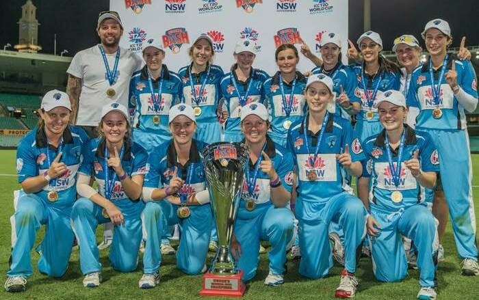 Big things ahead: Kate Jackson (front row, centre) will take up a new role with Cricket NSW this summer as Coffs Coast look to defend their Regional Bash crown. Photo: supplied
