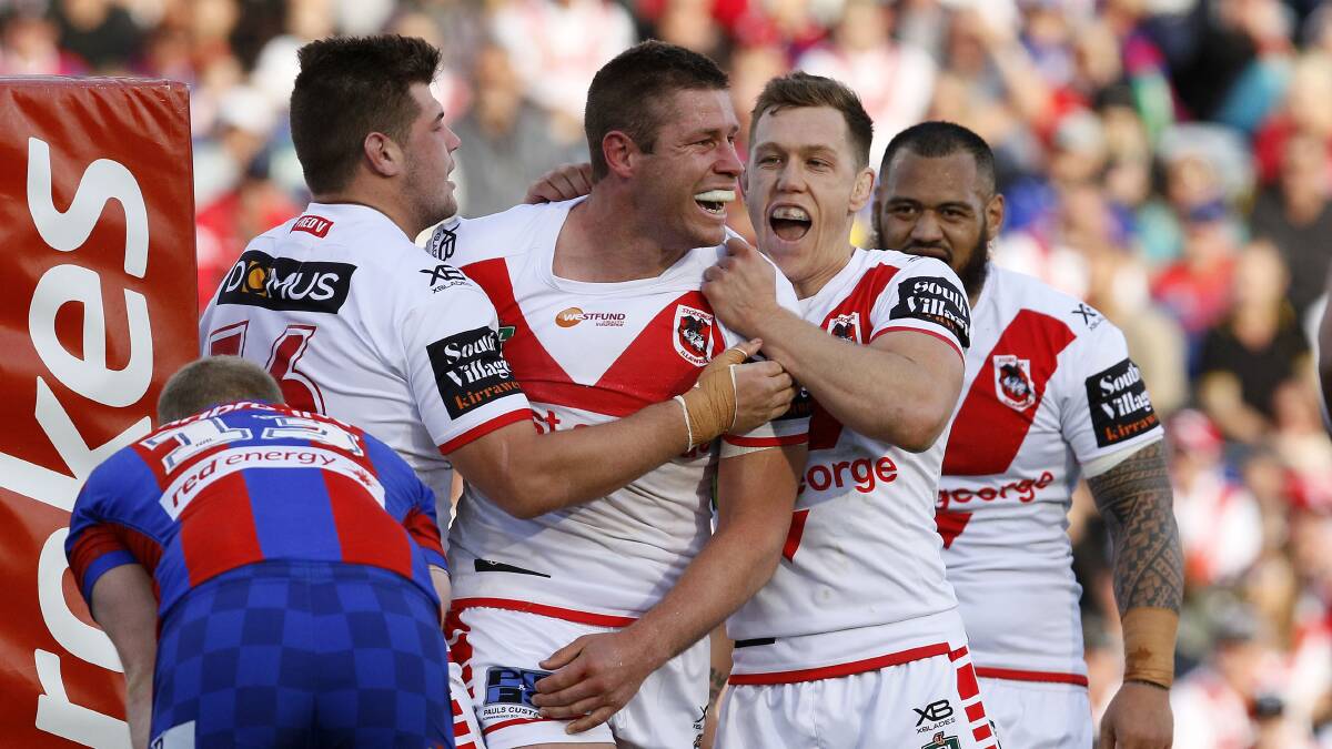 Try time: Jeremy Latimore celebrates scoring a second-half try during the Round 25 NRL match between Newcastle and St George-Illawarra. Photo: AAP/Darren Pateman