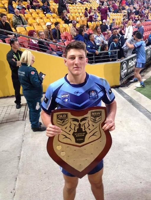 Winning ways: David Hollis with the State of Origin shield after the Blues won the under-16 clash in 2017. Photo: supplied