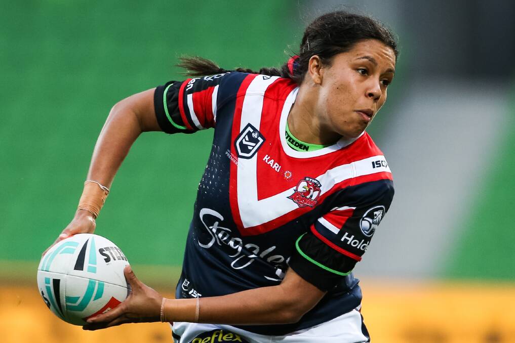 Hard work: Simone Smith shapes to pass during her NRLW debut for the Sydney Roosters on Saturday. Photo: supplied
