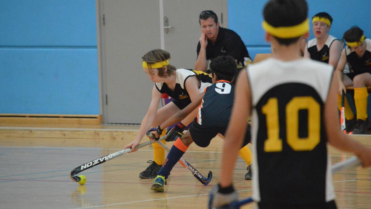 Hold it: Patrick Mainey controls the ball during Port Macquarie-Hastings' state indoor hockey title campaign. Photo: Matt Findlay