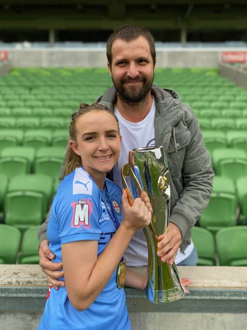 Winners are grinners: Rhali Dobson and partner Matt Stonham after Melbourne City's W-League grand final win. Photo: supplied