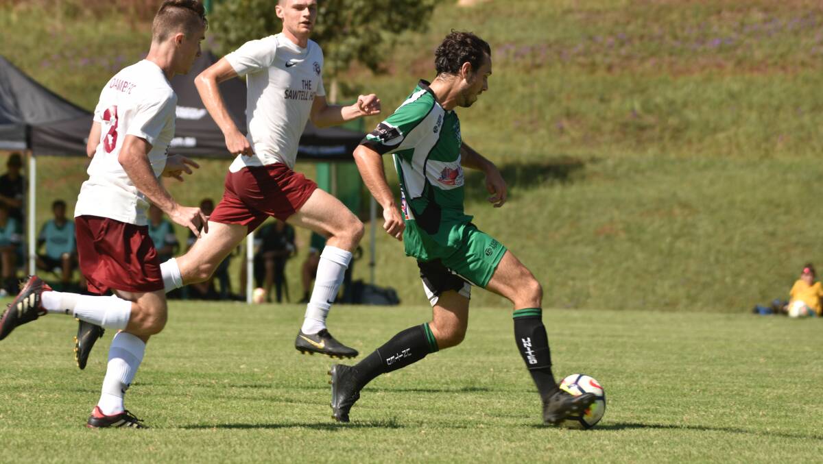 Working hard: Matt Bale helped set up Port United's equaliser in Saturday's 1-all draw with Taree.