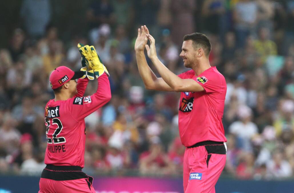 Got him: Josh Philippe and Josh Hazlewood celebrate a wicket during the Sixers' seven-wicket win in Coffs Harbour last season. Photo: supplied
