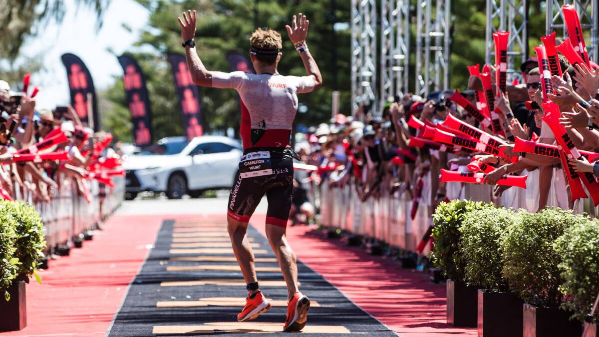 Cameron Wurf celebrates on the way to winning 2019 Ironman Australia in Port Macquarie. Photo: supplied