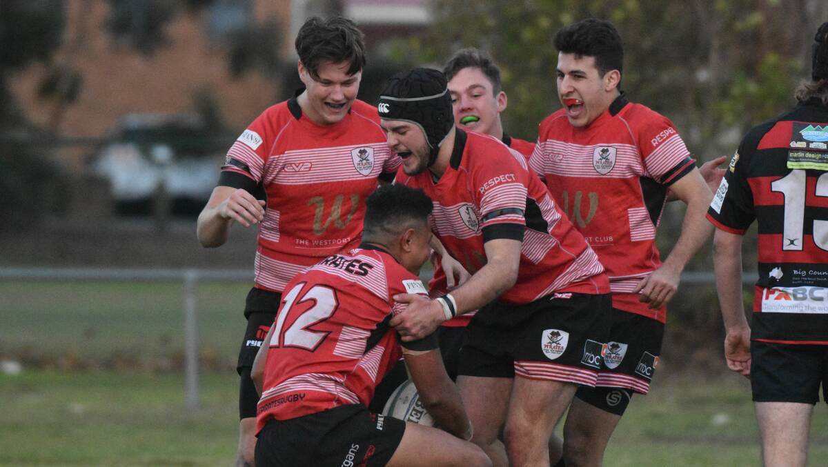 Time to shine: Kaes Besseling (centre) celebrates a try last weekend. Photo: Paul Jobber