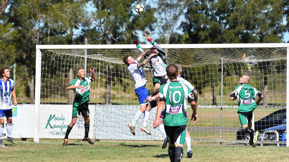 Aerial contest: Port United goalkeeper Cameron Higham challenges for the ball in last season's CPL southern conference grand final. Photo: Penny Tamblyn