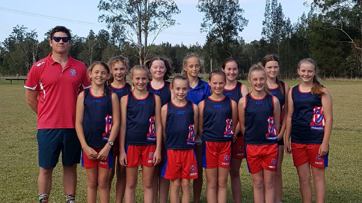 On their way: Telegraph Point Public School girls PSSA touch football knockout team with coach Adam Chalmers.