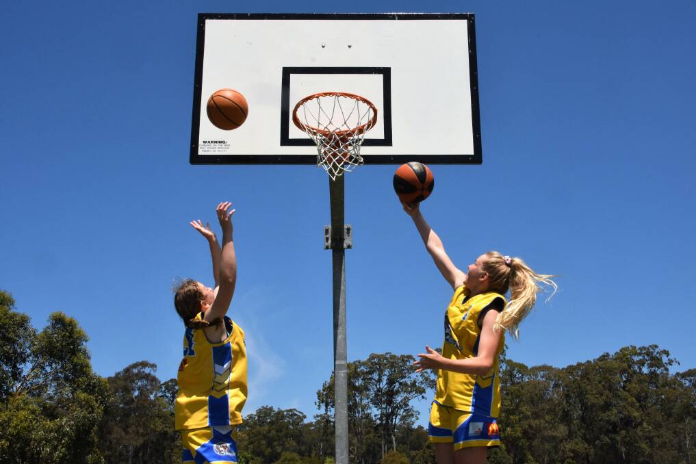 On target: Monique Rudder and Maddi Baxter shoot for the basket.