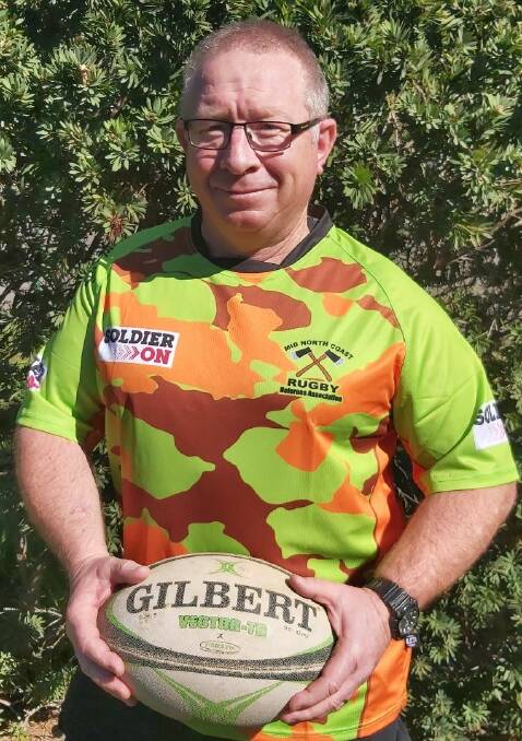 Good cause: Scott Bailey with the specially designed jerseys for Saturday.