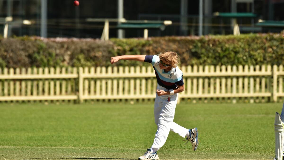 Give it air: Tom Marchant sends down a delivery during SCAS' six-wicket victory.