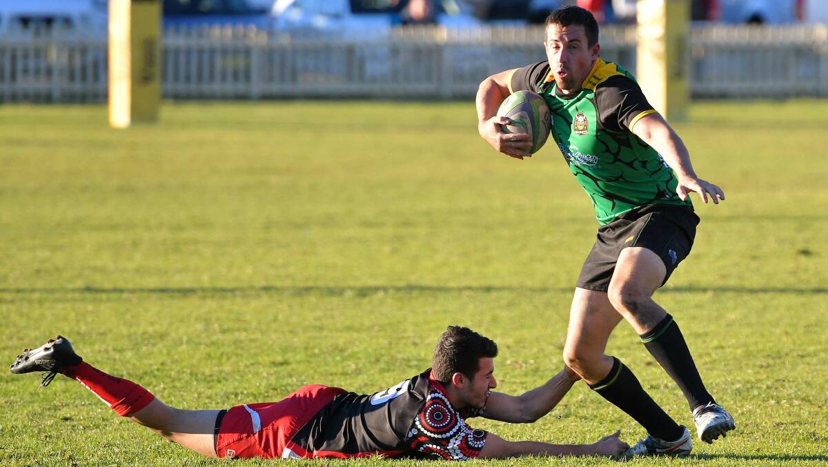 Off and running: Dan Willoughby evades the Pirates defence.