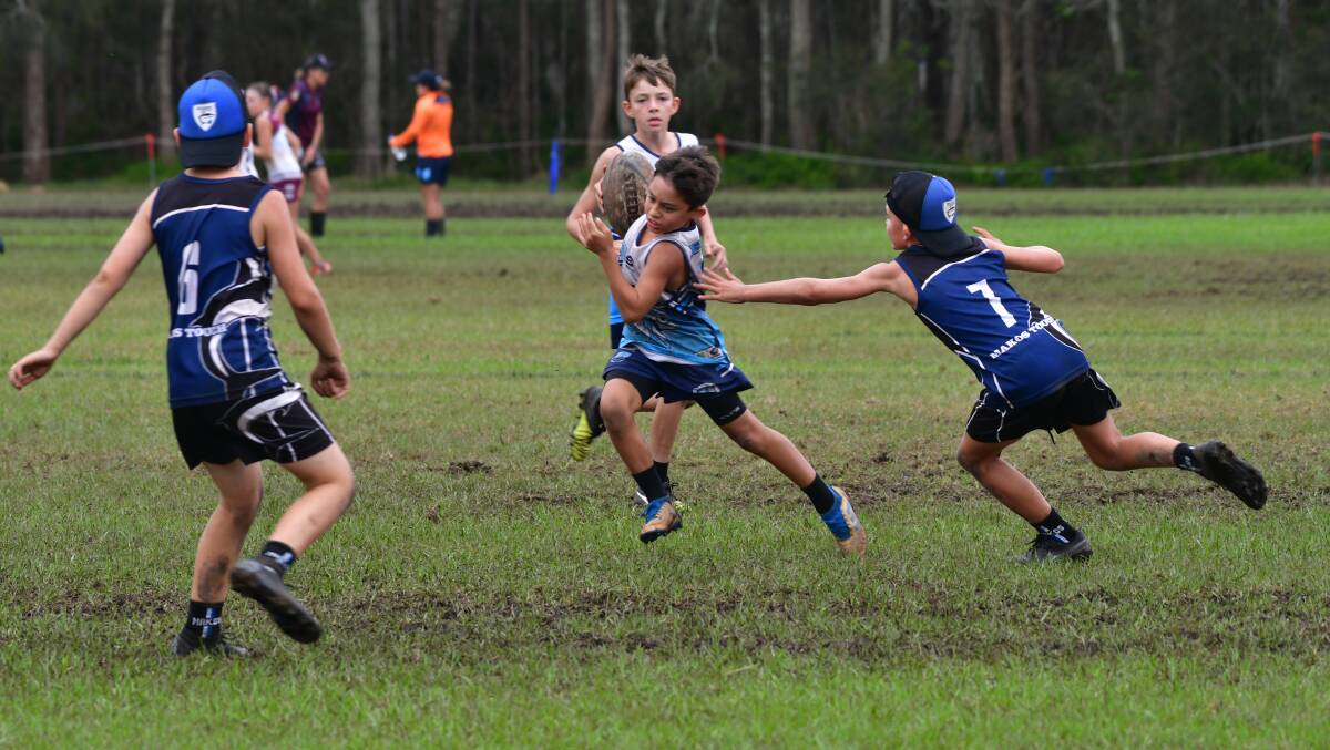 Got him: Jack Lacey works hard in defence at the NSW Junior State Cup northern conference in Port Macquarie.