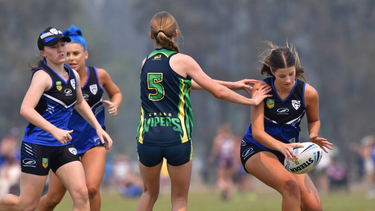 Hard yards: Port Macquarie's Chloe Eichmann takes the ball forward during the 2019 NSW State Cup. Photo: Paul Jobber