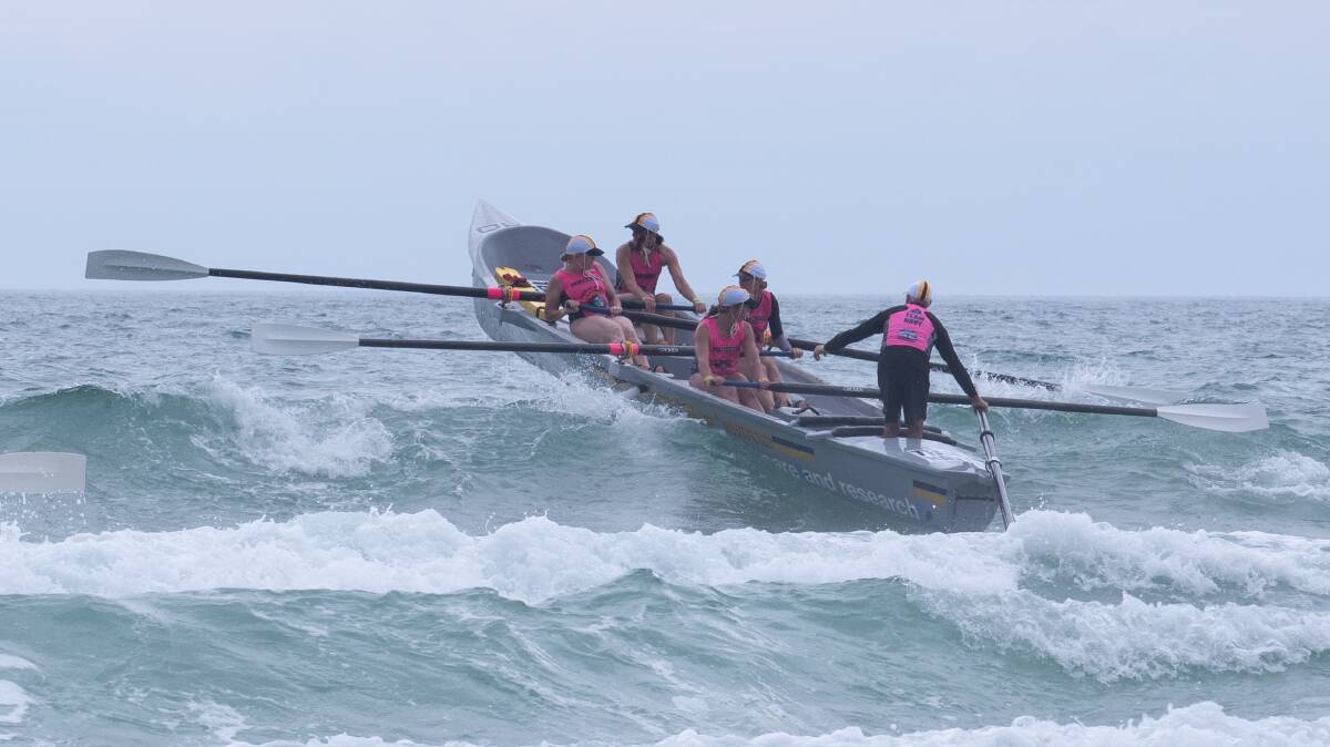 Over you go: Port Macquarie's Gun Mum's crew will head to the Ocean Thunder Surfboat Series in January. Photo: supplied/Phil Kaufmann
