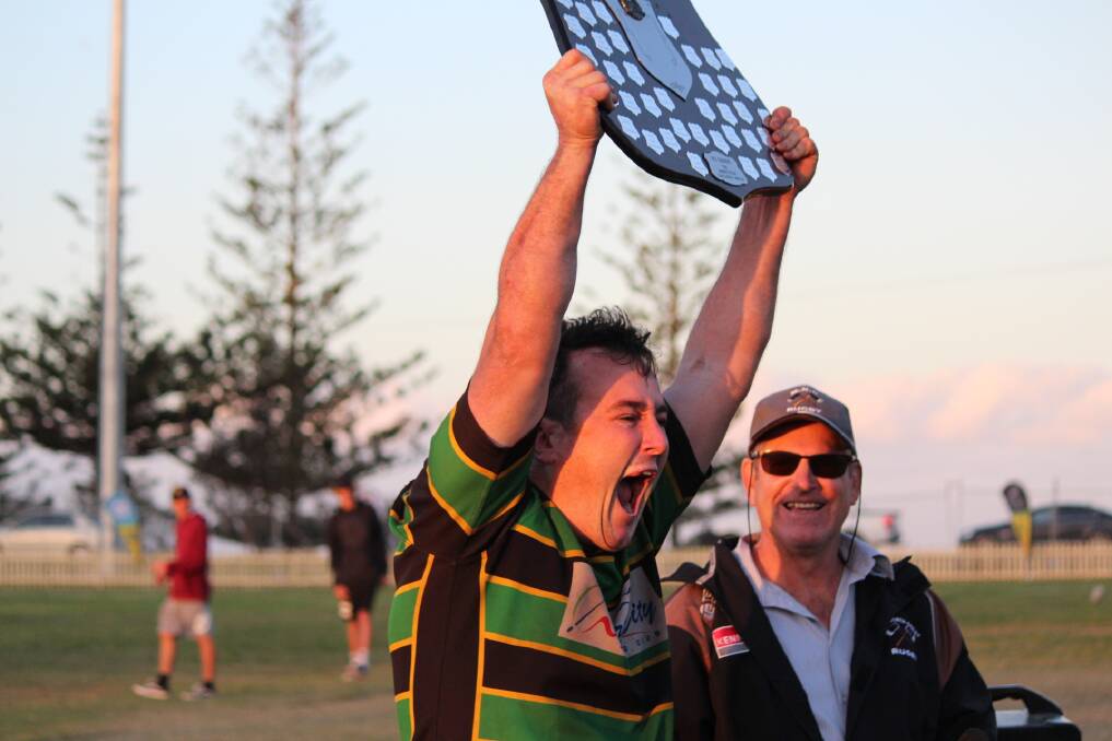 How good: Hamish McCormack lifts the shield after Hastings Valley's 41-10 grand final victory.