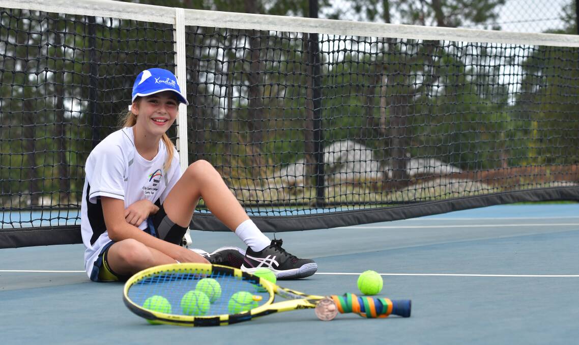 All smiles: The 11-year-old Kendall Tennis Club junior is one of a number of young players who idolise women's current world number one Ash Barty.