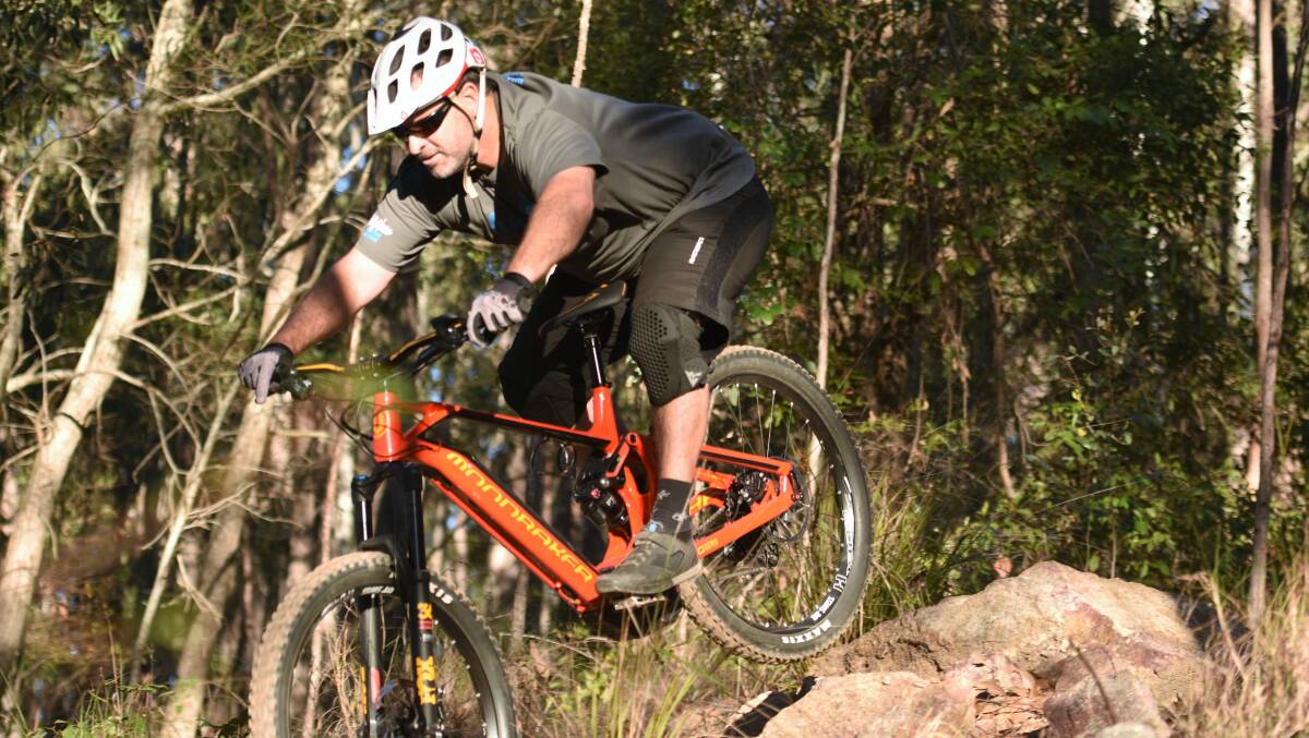 On the way down: David Poulton tests out his ebike ahead of this weekend's state championships. Photo: Paul Jobber