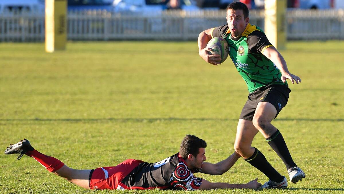 Around him: Dan Willoughby evades a tackle during last week's win over Port Pirates. Photo: Paul Jobber