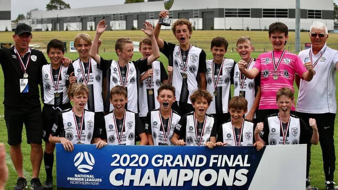 Winning feeling: Mid Coast under-13s celebrate their grand final win on Saturday. Photo: supplied