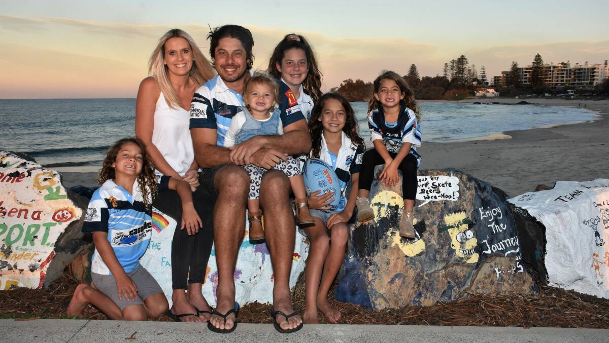 Family first: Brax, Shelley, Dan, Gypsy, Layla, Jesse and Coco Dumas ahead of Dan's 150th first grade game for Port City on Saturday. Photo: Paul Jobber