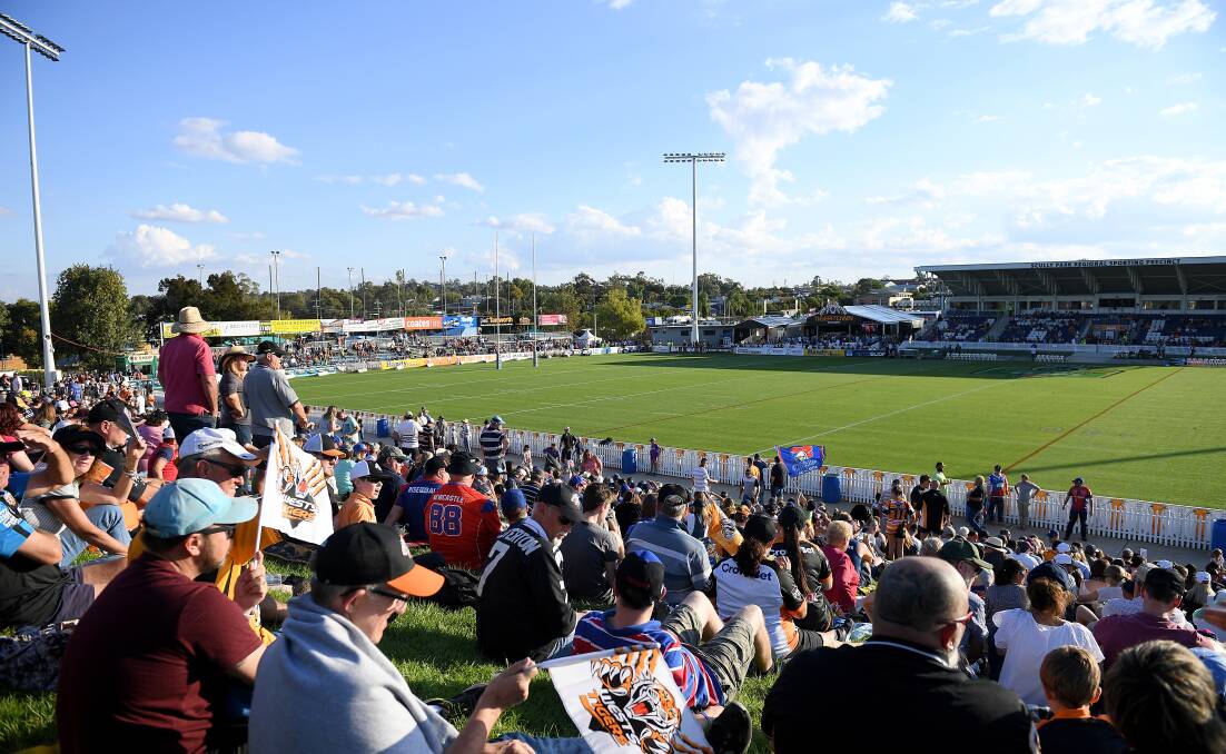 Good turn-out: Spectators are seen in the crowd ahead of the Round 7 NRL match between the Wests Tigers and the Newcastle Knights at Scully Park. Photo: AAP Image/Dan Himbrechts.