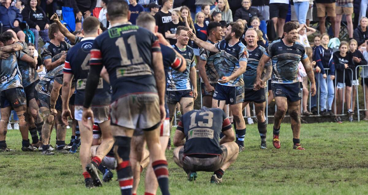 Port City celebrate while a downcast Old Bar Pirates reflect after the Group 3 rugby league grand final, won 20-12 by the Breakers. Photo: Lighthouse Sports Photography/Kurt Polock