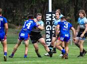 Port Macquarie Sharks forward Koby Smith takes the ball up last weekend. The match with Wauchope last weekend was one of the few to have so far been completed this season.