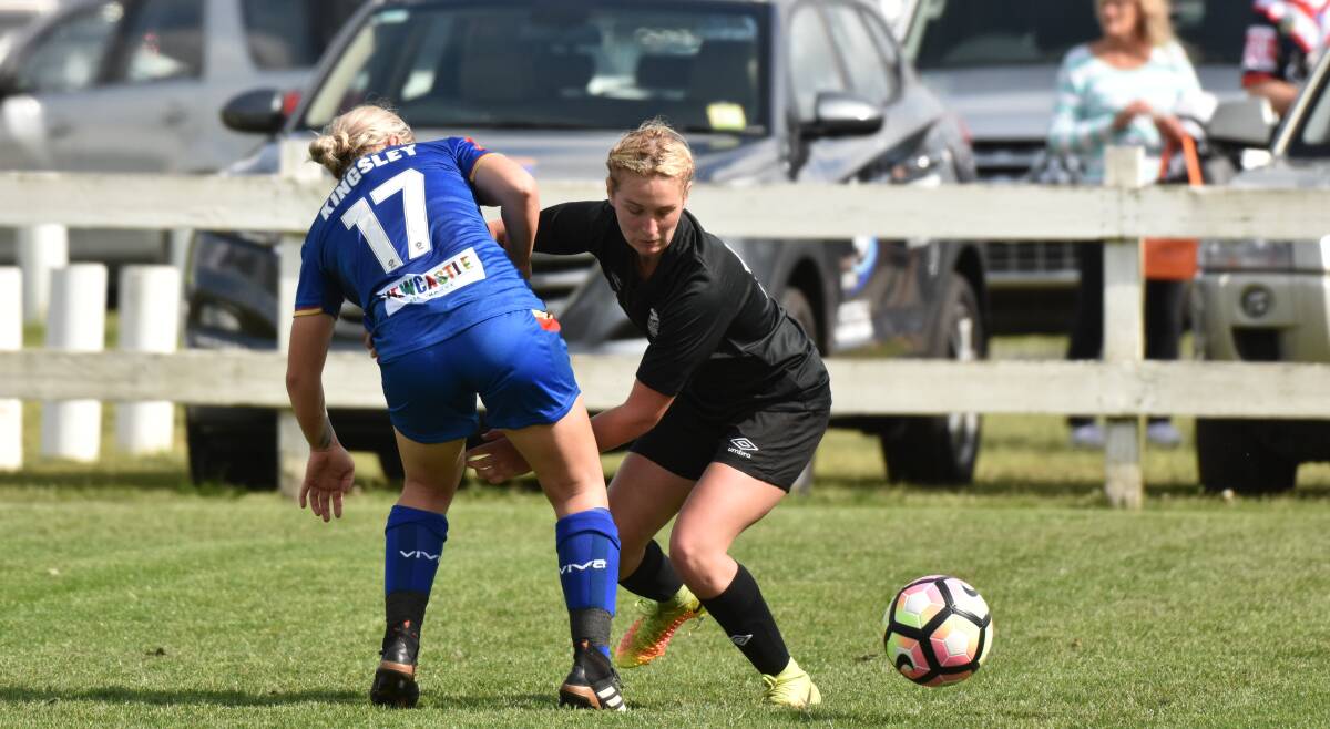 Points decision: Layni Fens touches the ball away from Newcastle Jets midfielder Jenna Kingsley. Photo: Paul Jobber