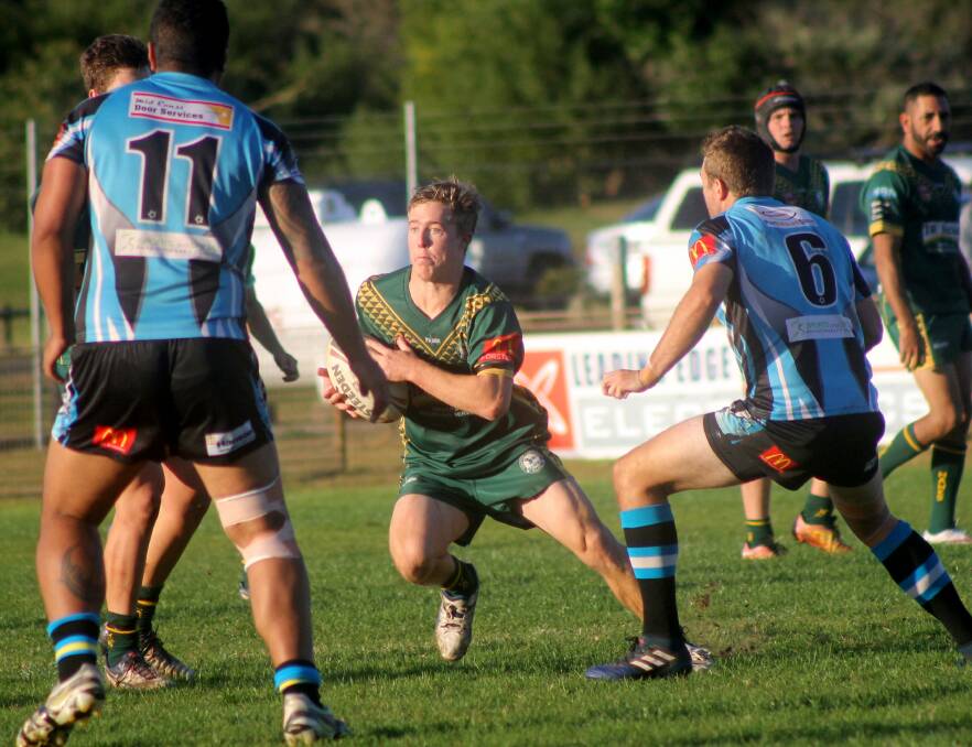 Looking for room: Hawks halfback Riley Glover was among the best v the Port Sharks on Sunday.