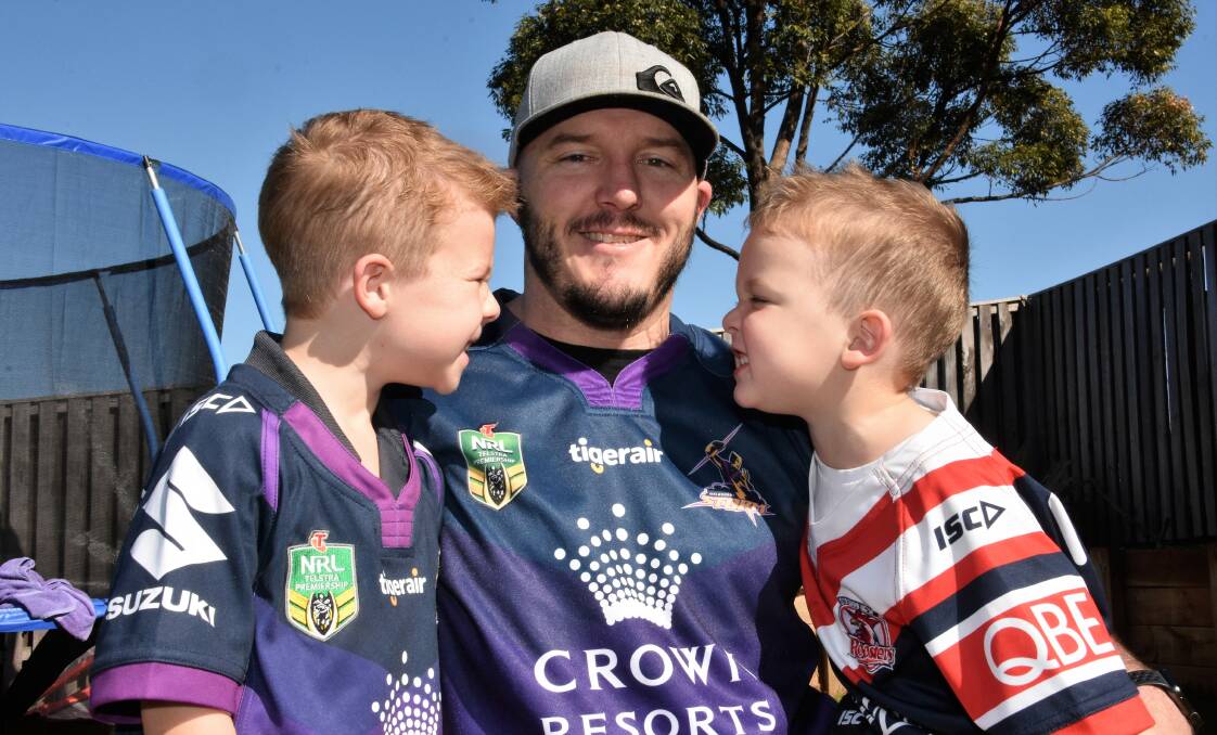 Outnumbered: Bailey and Flynn Ackroyd with dad Luke ahead of Sunday's National Rugby League grand final. Photo: Paul Jobber