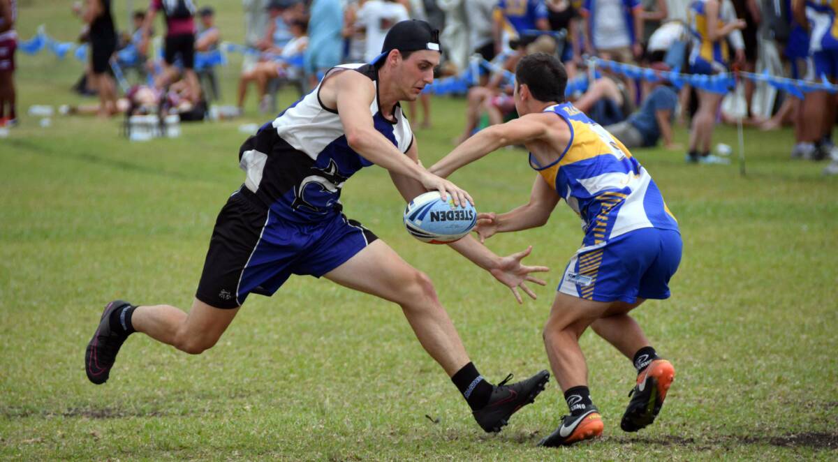 One-handed: Port Macquarie's Jarod Thomas tries to evade the Parramatta defence on day two at this year's NSW State Cup. Photo: Ivan Sajko