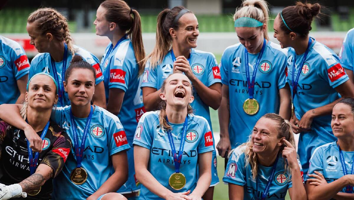 Happy days: Rhali Dobson (centre) shares a laugh with her teammates. Photo: supplied