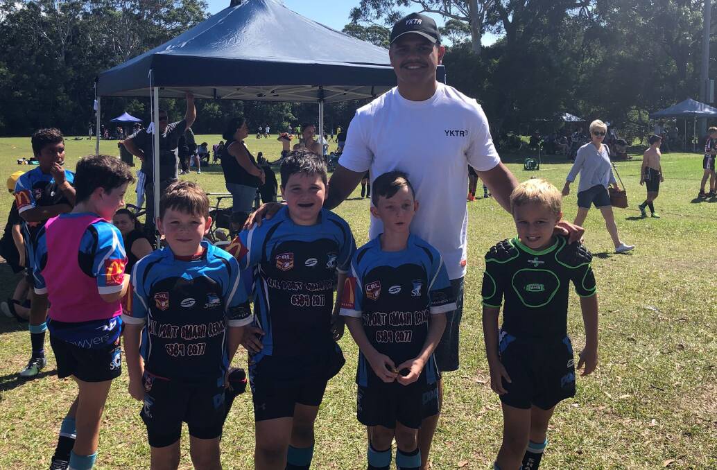Brush with fame: Sydney Roosters centre Latrell Mitchell with the junior Sharks on Sunday. Photo: supplied