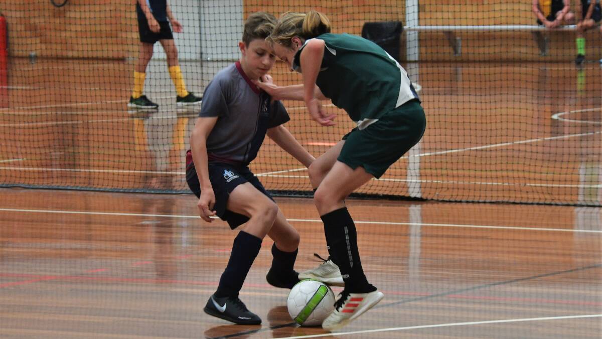 My ball: St Joseph's Primary School's Hudson Bell keeps possession at the East Coast School Futsal Titles. Photo: Paul Jobber
