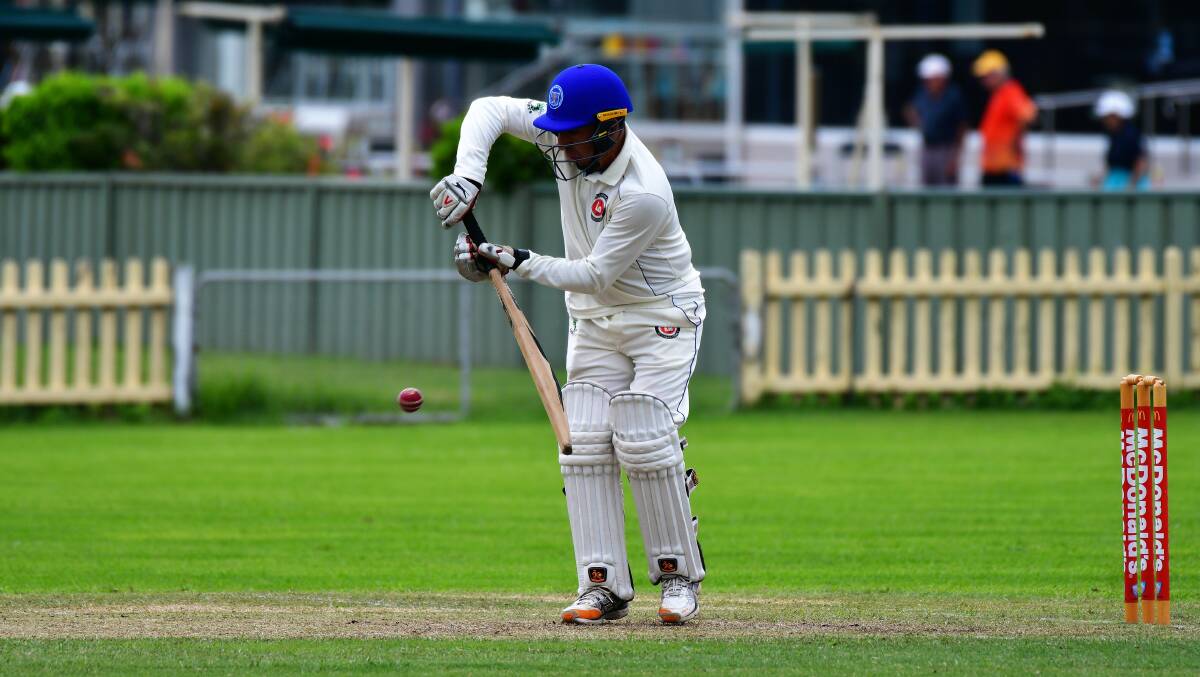 Head down: Fugur Huseyin plays a straight bat during Mid North Coast's five-wicket over-50s win on Sunday. Photo: Paul Jobber